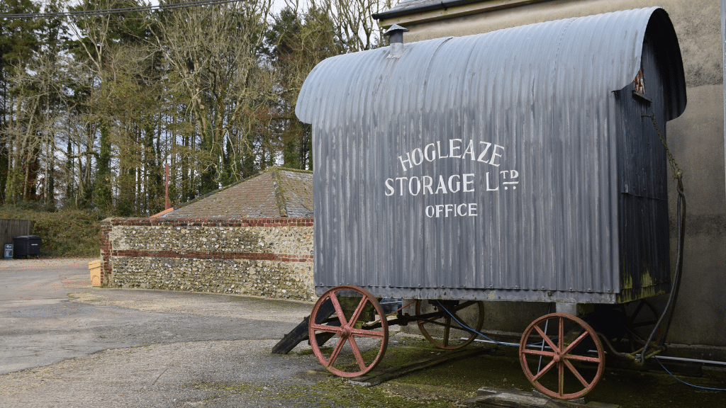 Metal Shephards Hut with the Hogleaze logo written on the side in white lettering